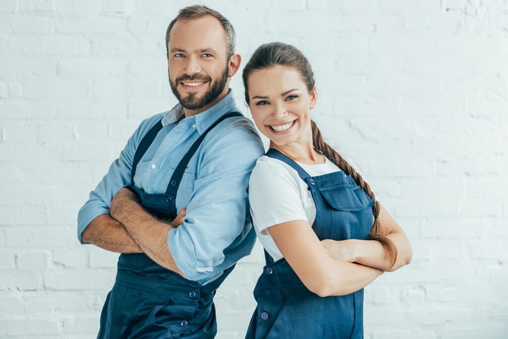 smiling-confident-workers-in-uniform-posing-with-c-H8X2FYE.jpg