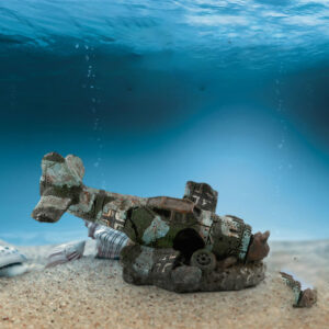 4022319464556jpg - Aquassi Ltd | Award-winning Aquarium Design & Aquascaping Underwater Scene of a Broken Toy Airplane Wreck on a Sandy Seabed, with Shells Nearby and Bubbles Rising to the Surface.