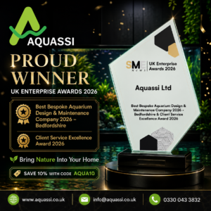 Award-themed Graphic Announcing Aquassi As a Proud Winner at the Uk Enterprise Awards 2026, Featuring a Tilted Glass Trophy and Gold Text Elements.