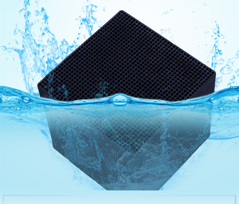 Efb91c1f-3055-4e51-9701-2a86f051d4b7-1jpg - Aquassi Ltd | Award-winning Aquarium Design & Aquascaping Black Cube Air Filter Partially Submerged in Blue Water with Splashes, Emphasizing Filtration Technology
